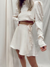 CHAMPAGNE WRAP MINI SKIRT